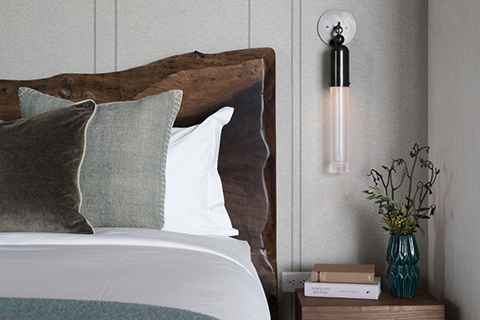 modern bedroom at caldera residence jackson wyoming featuring apparatus tassel sconce