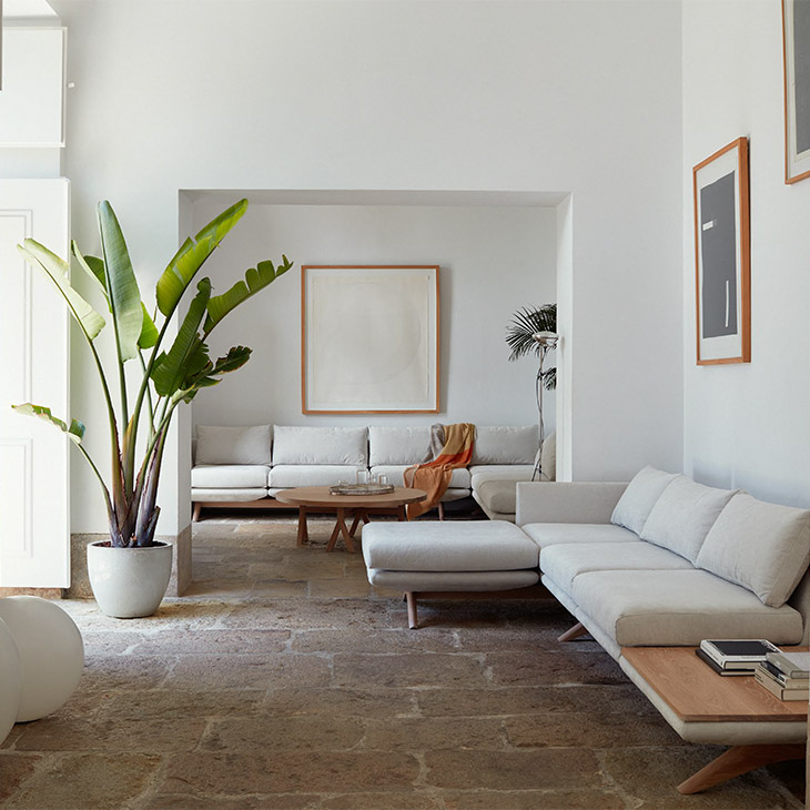 white living room featuring de la espada sofas and coffee table