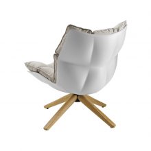 shell of a b&b italia husk armchair with wood base on a white background