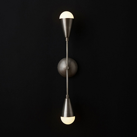 apparatus dyad sconce on a black background