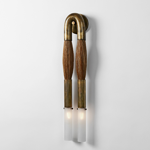 apparatus horsehair sconce on a soft grey background