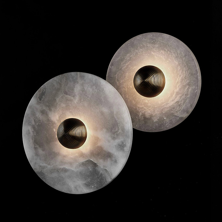 both sizes of the apparatus median sconces on a black background