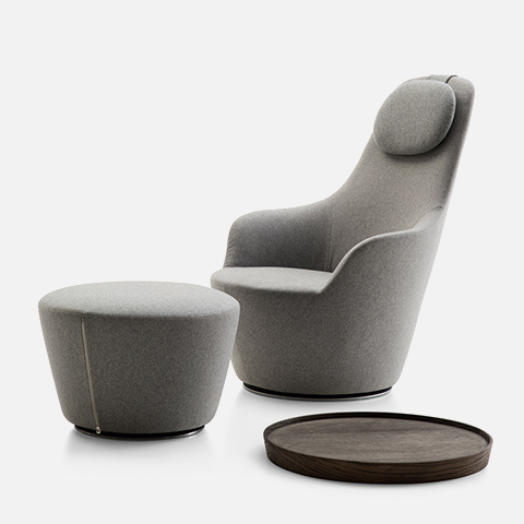 grey b&b italia harbor armchair and ottoman on a grey background