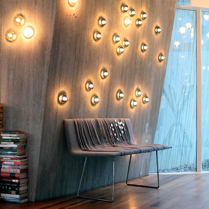 modern interior space featuring 14s surface lights on a concrete wall