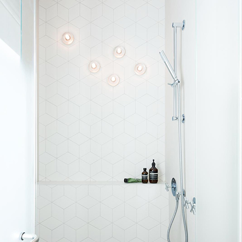 modern bathroom featuring bocci 14s surface lights