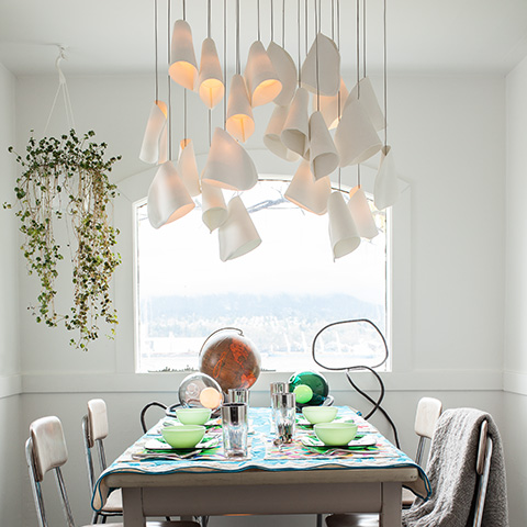modern dining room featuring bocci 21 series pendant light