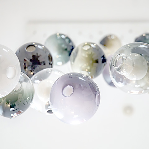 close up of colorful glass spheres of bocci 28 series pendant light