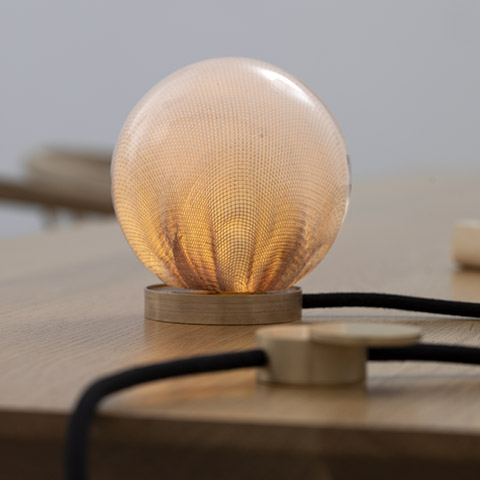 close up of bocci 73t table lamp on wood table