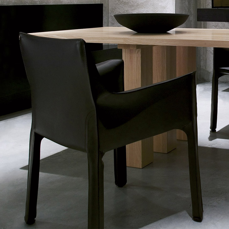 modern dining room featuring cassina cab dining arm chair