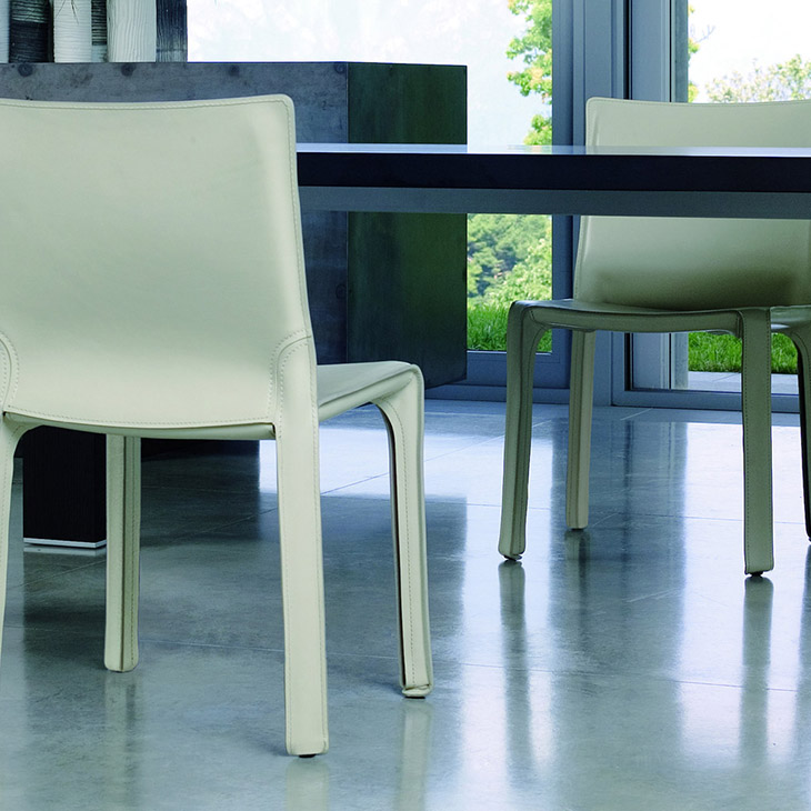 modern dining room featuring cassina cab dining chairs