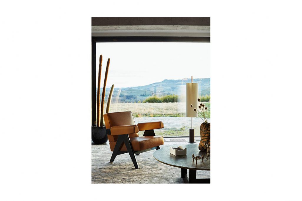 modern living room featuring a cassina capitol complex armchair chair