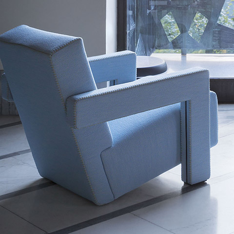 modern living room featuring cassina utrecht armchair