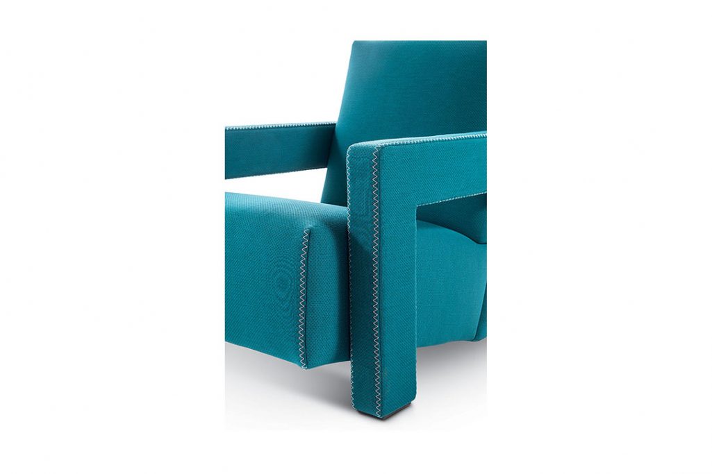 close up of zig zag stitch on a cassina utrecht armchair on a white background