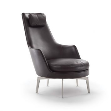 black leather flexform guscioalto armchair on a white background