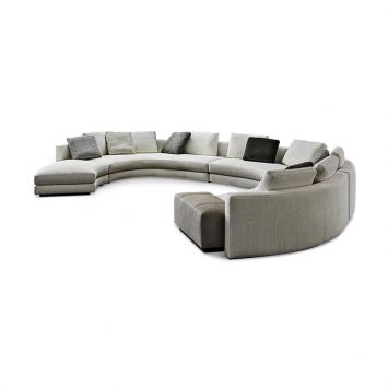 curved minotti daniels sofa on a white background