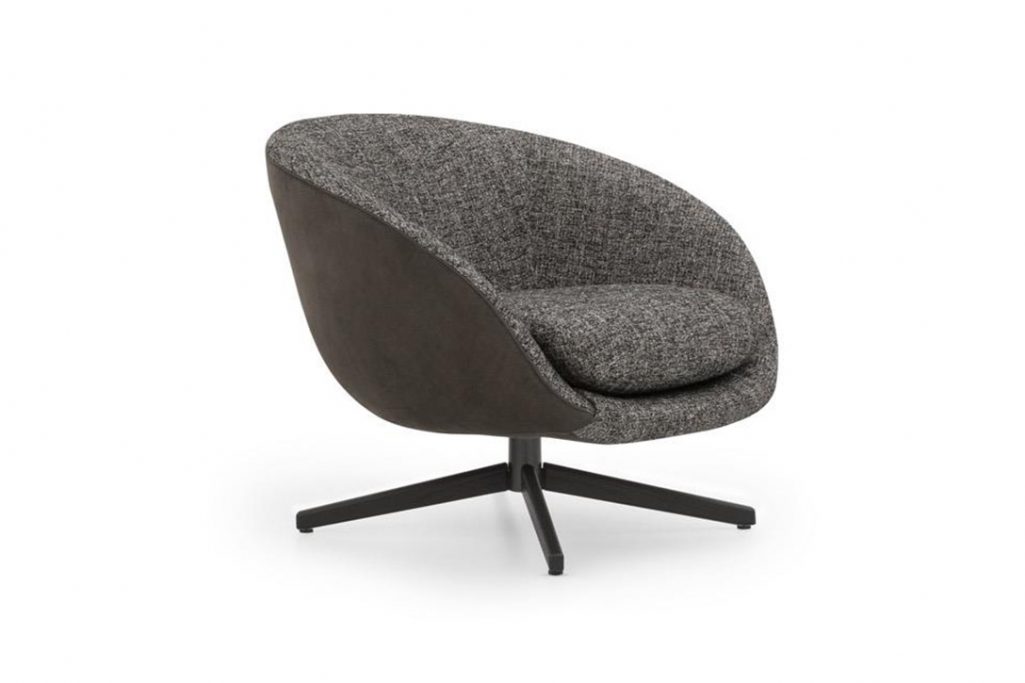 minotti russell armchair swivel on a white background