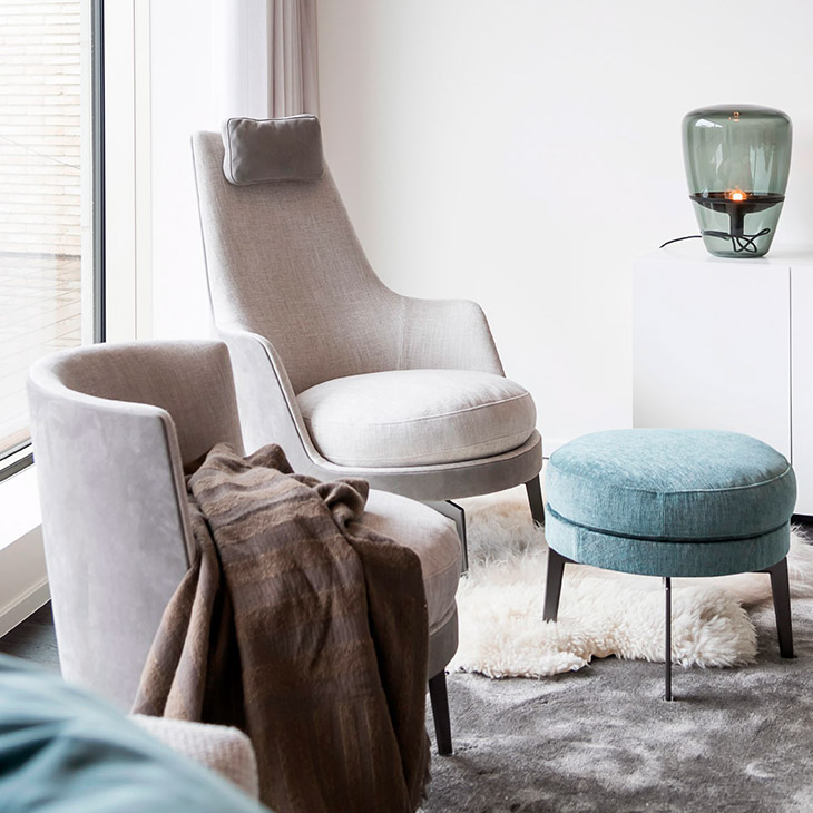 modern living room featuring a flexform guscioalto armchair