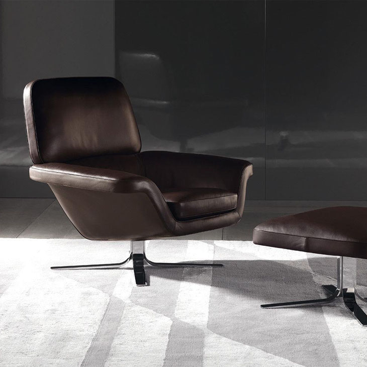 modern living room featuring a minotti blake-soft armchair