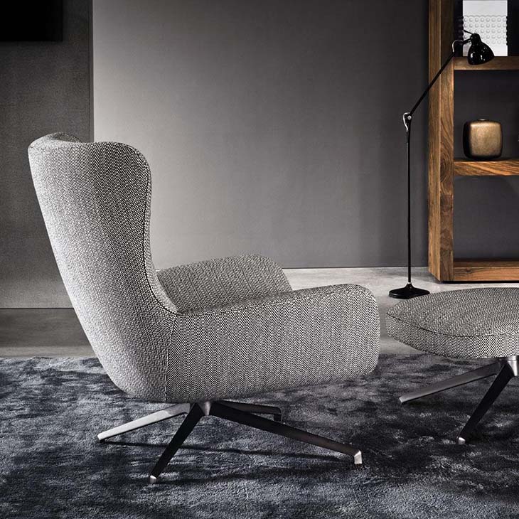 modern living room featuring minotti jensen armchair and ottoman