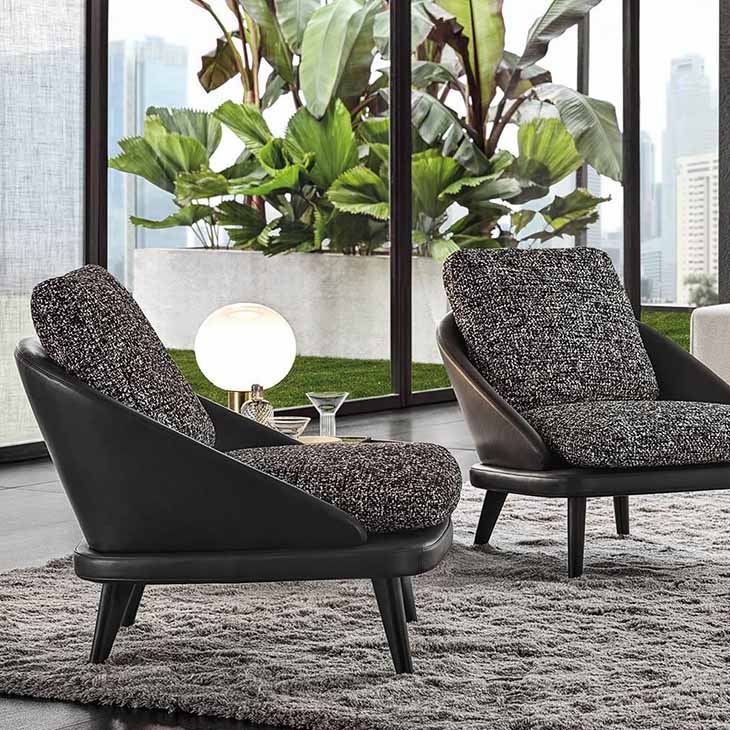 modern living room featuring two minotti lawson armchairs with wood legs