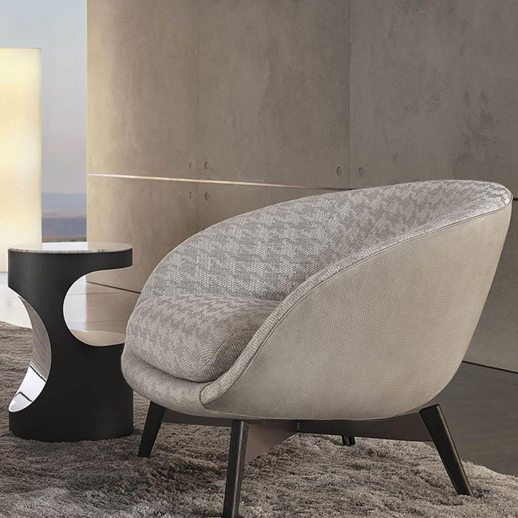 modern living room featuring minotti russell armchair