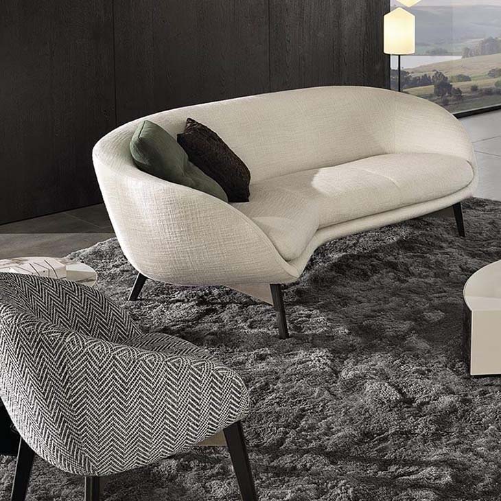 modern living room featuring minotti russell sofa and armchair