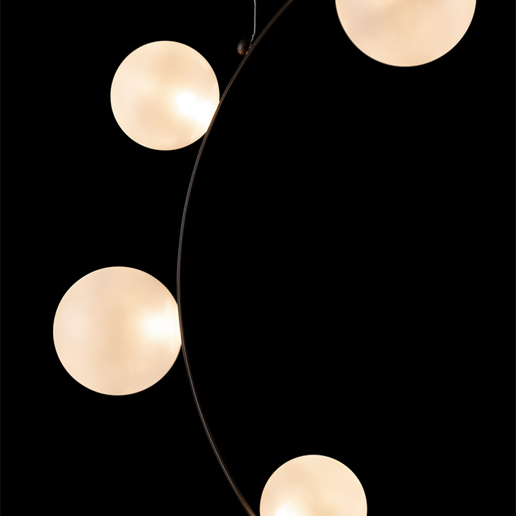 close up of moooi hubble bubble pendant light on a black background