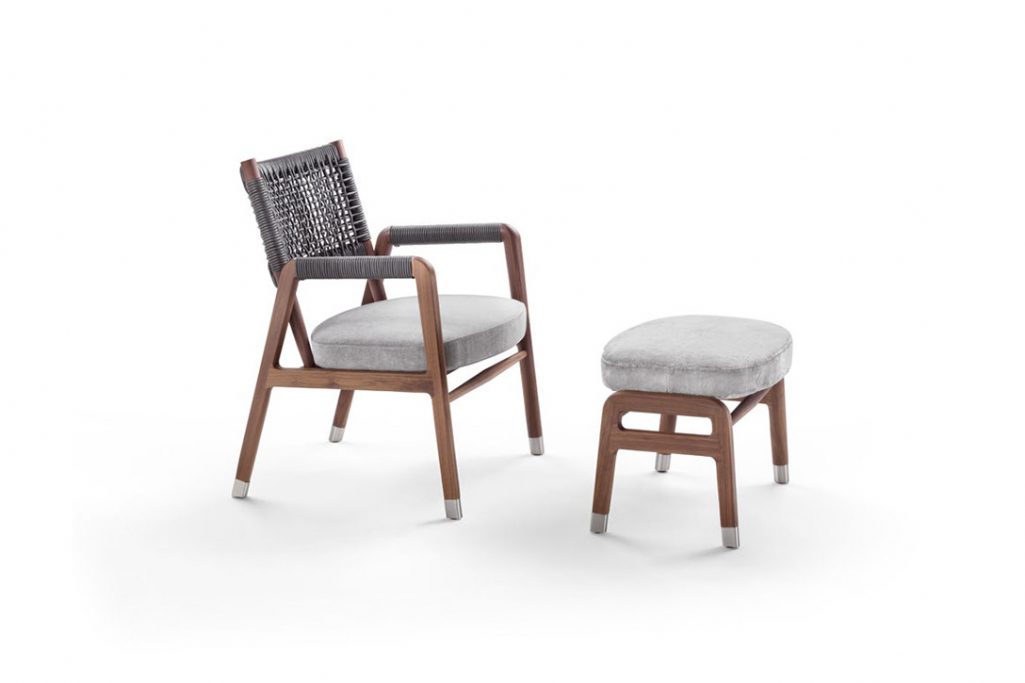 flexform ortigia armchair and ottoman on a white background