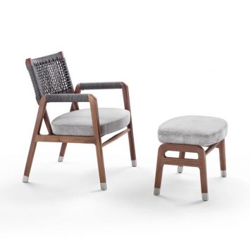 flexform ortigia armchair and ottoman on a white background