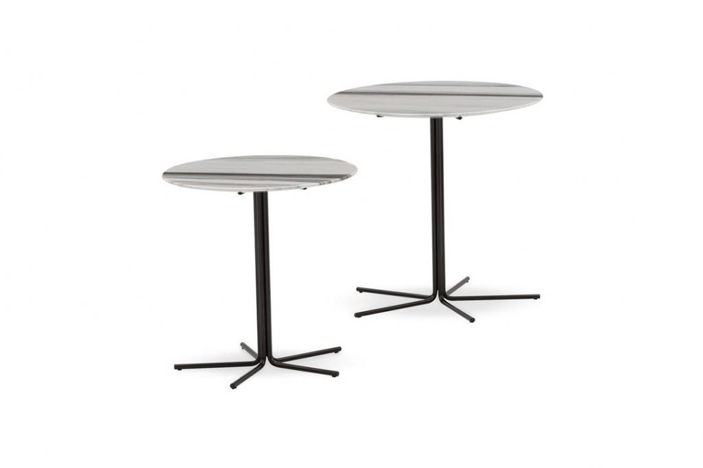two minotti rays side tables on a white background