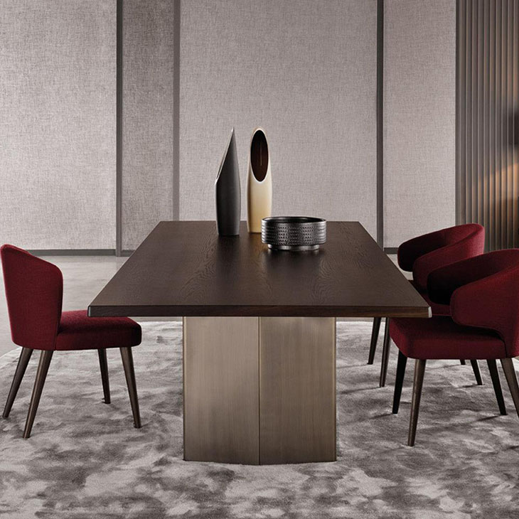 modern dining room featuring minotti aston dining arm chairs