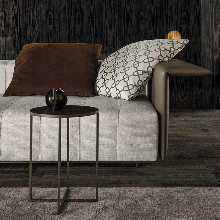 modern living room featuring a minotti duchamp bronze table
