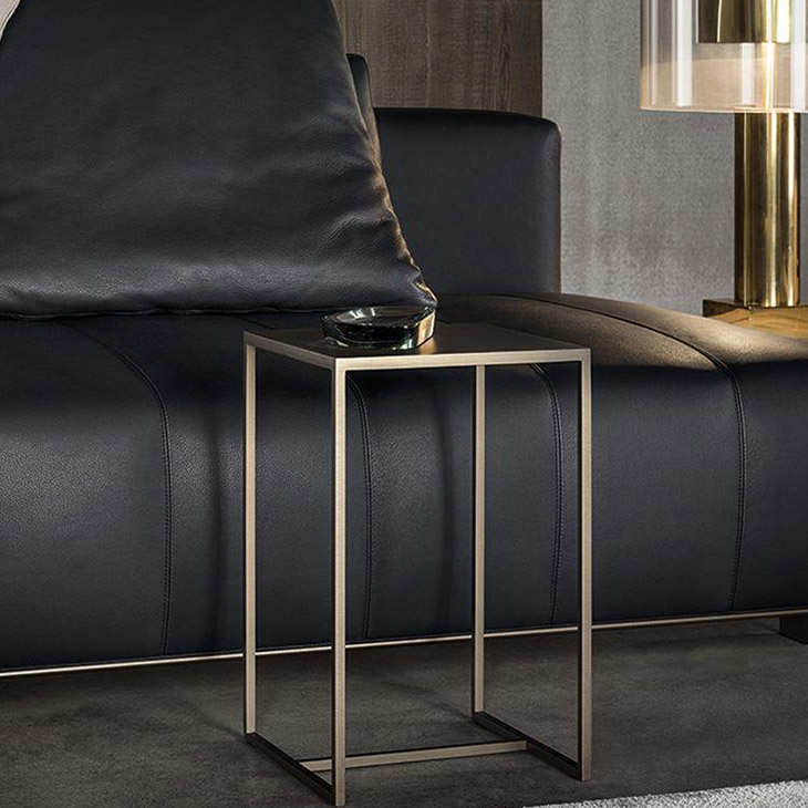 modern living room featuring a minotti duchamp bronze table