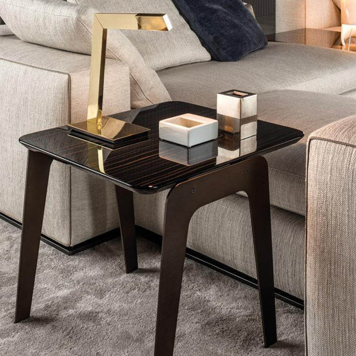 modern living room featuring a minotti kirk jut out top side table