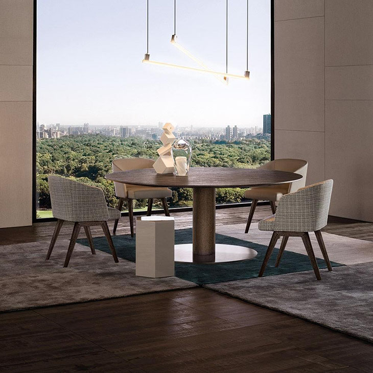 modern dining room featuring minotti reeves dining chairs