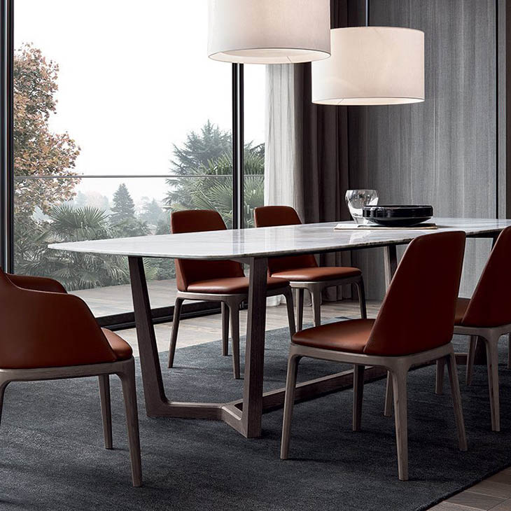 modern dining room featuring poliform grace dining chairs