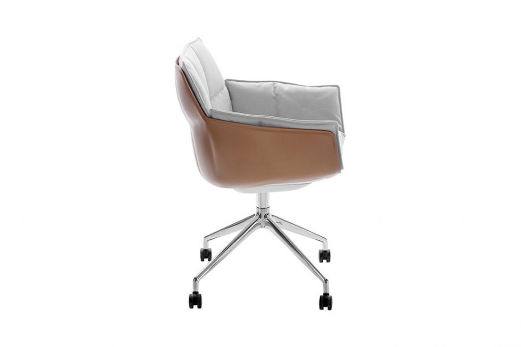 b&b italia husk chair on wheels on a white background