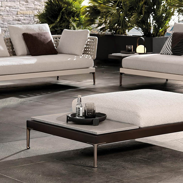 minotti patio outdoor sofas and ottoman in situ