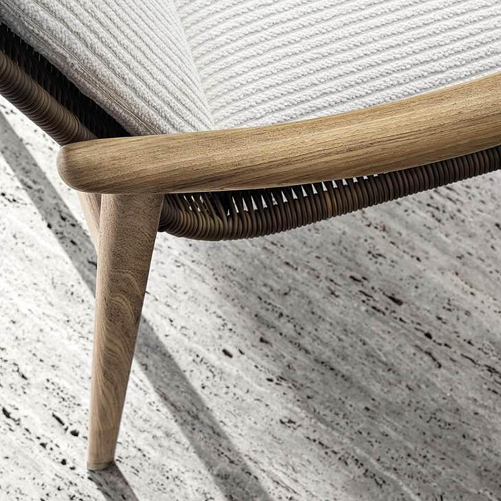 close up of armrest on a minotti fynn outdoor dining arm chair in situ