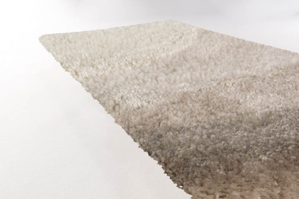 side view of limited edition agate low rug in whisper swan