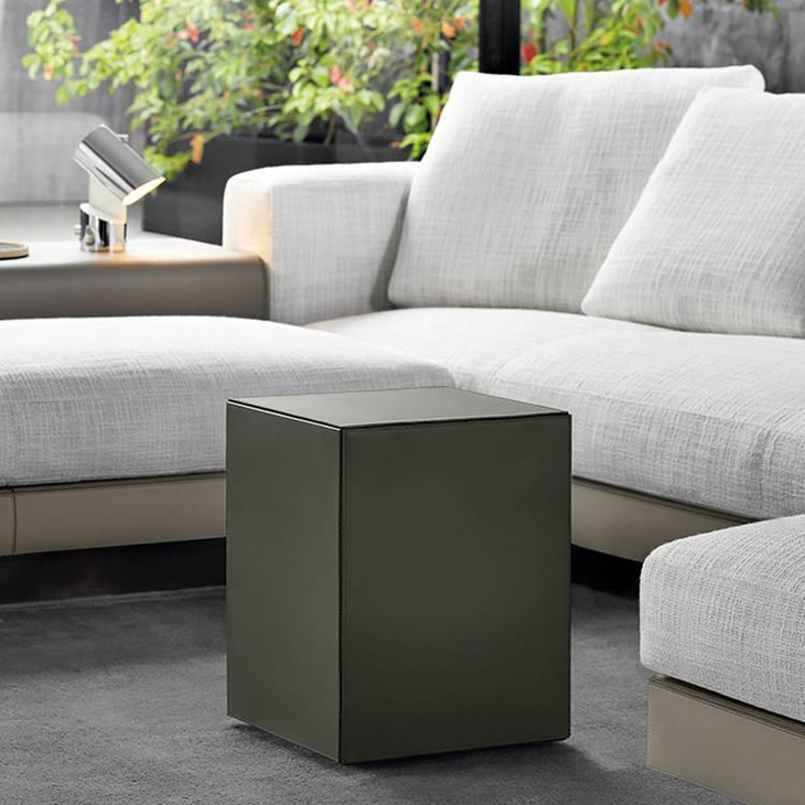 minotti solid saddle-hide side table or pouf in situ