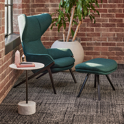 cassina p22 armchair and ottoman in situ