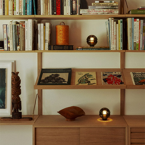 bocci 14p table lamps on a bookshelf